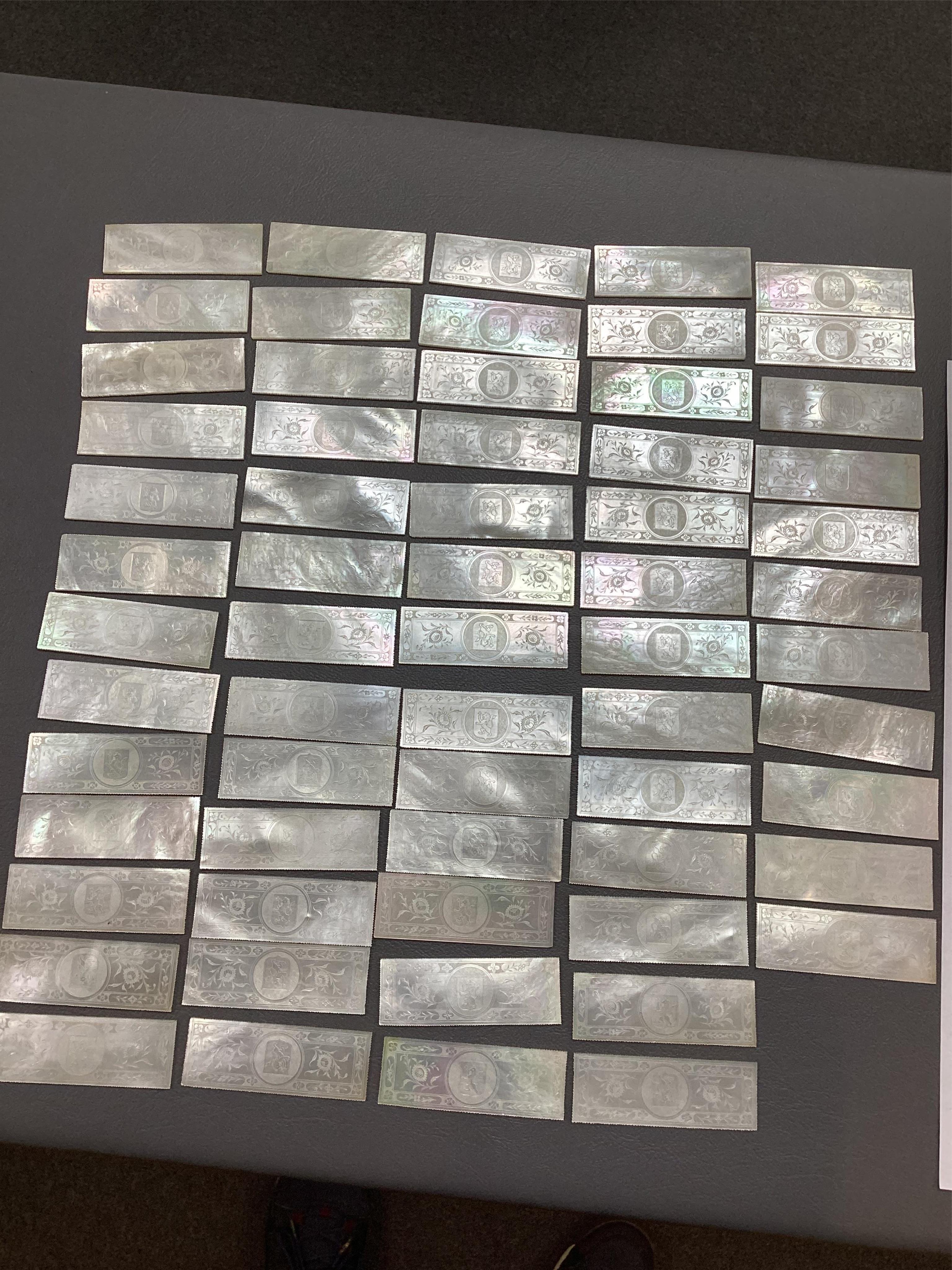 Two Chinese gilt decorated black lacquer games boxes, containing numerous mother-of-pearl counters, 19th century